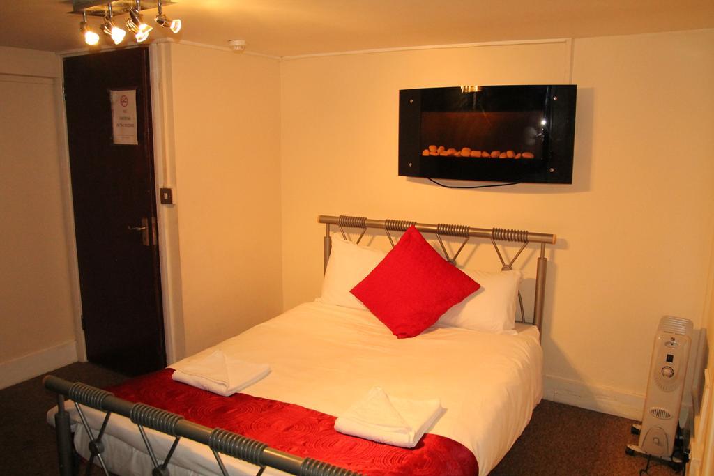London Olympus Hotel Nirvana Quarto foto