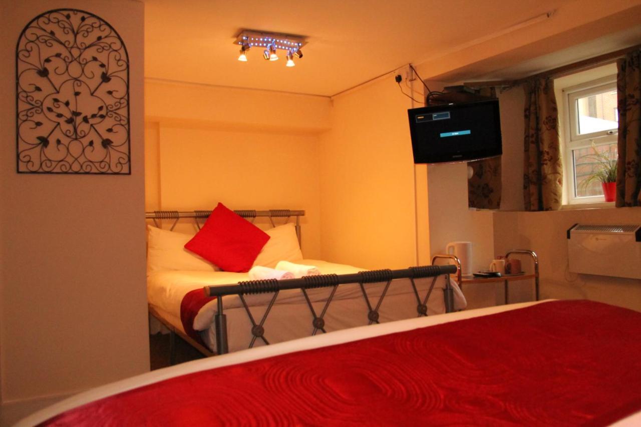London Olympus Hotel Nirvana Quarto foto